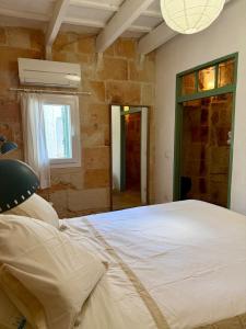 Postel nebo postele na pokoji v ubytování Caseta típica amb encant al Casc antic Ciutadella