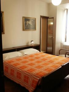 Кровать или кровати в номере Albergo Corona