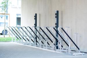 a row of metal folding chairs lined up against a wall at RELAXANS Hotel in Dinkelsbühl