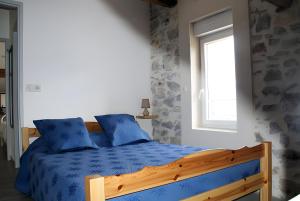 En eller flere senge i et værelse på Le Gîte Du Vieux Mûrier Côté Sud