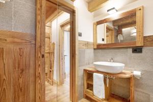 a bathroom with a sink and a mirror at Casa Promindoz in Valtournenche +24 photos