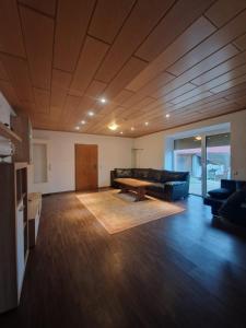 a living room with a couch and a table at Ferienwohnung-La Casa in Heidenheim