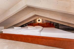 Postel nebo postele na pokoji v ubytování Apartmán SKIBIKE, Hrabovo