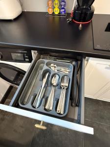 a drawer in a kitchen with utensils in it at Flat In the heart of Kaunas city center in Kaunas