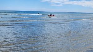 a group of people in a boat in the ocean at Casablanca in Dwarskersbos