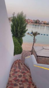 a stairway with a view of a body of water at شاليه مارفن درة العروس البرادايس in Durat  Alarous