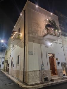 a building with two balconies on the side of it at B&B Novecento Italiano in Altamura