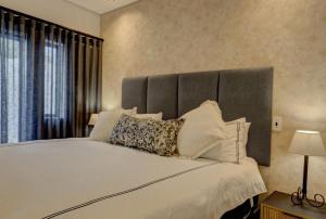 Ένα ή περισσότερα κρεβάτια σε δωμάτιο στο Modern 3-Bedroom Home in Arbour Nature Estate