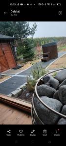 a picture of a yard with a fire hydrant at Domki Na Winnicy Zator Przeciszów in Przeciszów