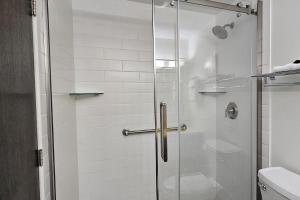 a shower with a glass door in a bathroom at Sugar Baby (B6) in Cedar +27 photos