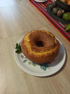 a donut sitting on a plate on a table at The Goat's Place III in Gaula +21 photos