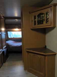 a small kitchen with a bed in a small room at BeauCamp in Rhodes
