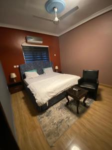 Ένα ή περισσότερα κρεβάτια σε δωμάτιο στο King David Guesthouse