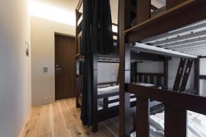 Postel nebo postele na pokoji v ubytování Shizuya KYOTO
