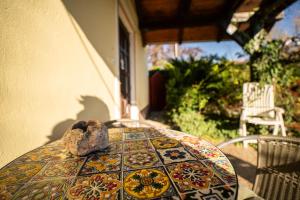 a table with a bowl on top of it on a patio at Czanadomb apartman in Cserkút