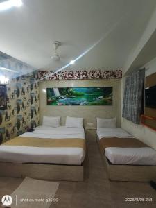 Ένα ή περισσότερα κρεβάτια σε δωμάτιο στο Hotel lavish Santuary