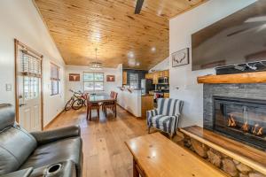 a living room with a couch and a fireplace at Cozy Cabin in Bison Ranch in Overgaard