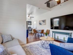 a living room with a couch and a table at Beachside Villa Unit 4 in Tybee Island