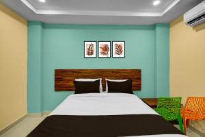 Ένα ή περισσότερα κρεβάτια σε δωμάτιο στο Hotel O MSR Grand Hotel