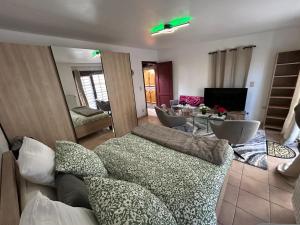 a living room with a couch and a table at Apartchrisbea in Namur