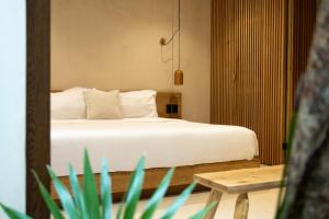 Postel nebo postele na pokoji v ubytování Teva Tulum, Aldea Zamá