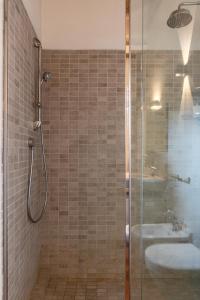 a bathroom with a shower and a sink at Luxe Paradise - 4 person, Historic Center in Modena +13 photos