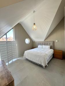 Postel nebo postele na pokoji v ubytování The Quays - Ten at Twilight