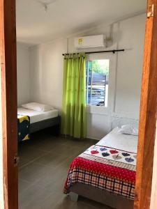 Ένα ή περισσότερα κρεβάτια σε δωμάτιο στο Santa Verónica Beach House