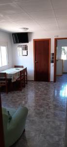 a living room with a ping pong table and a door at L'Hortet de Can Serra in Santander
