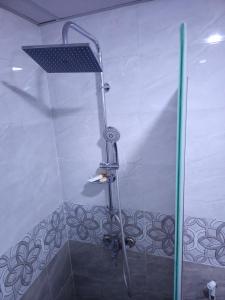 a shower with a shower head in a bathroom at SILENT SKY lUXURY CAMP in Wadi Rum