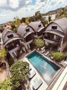 an aerial view of a house with a swimming pool at Naturela in Uluwatu
