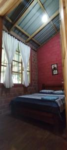 Postel nebo postele na pokoji v ubytování Mirador Jungle El Macuti