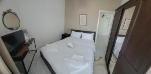 Ένα ή περισσότερα κρεβάτια σε δωμάτιο στο GF AXD Apartment