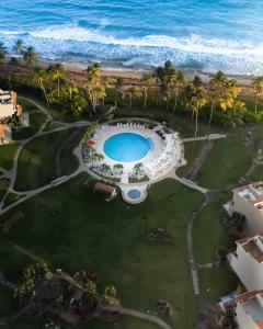 an aerial view of a resort with the ocean at Selah | Travelers Nesters in Palmas Del Mar in Buena Vista