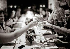 a group of people sitting around a table drinking wine at Selah | Travelers Nesters in Palmas Del Mar in Buena Vista +37 photos