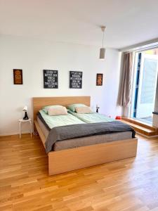 a bedroom with a large bed in a room at Central Suite with Balcony in Helsinki