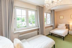 Postel nebo postele na pokoji v ubytování Haus mit großen Garten