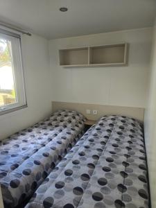 Postel nebo postele na pokoji v ubytování Mobil home 8 personnes Gastes