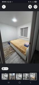 a picture of a bedroom with a bed in a room at Guest House in Talghar