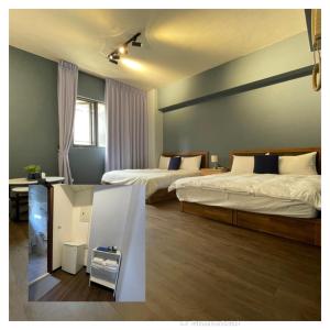 a hotel room with two beds and a desk and a table at Still Haus 静の宿 in Taichung