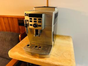 a coffee maker sitting on top of a table at Ski in & Ski out Apartment at Chalet Heinrich in Sonnenalpe Nassfeld