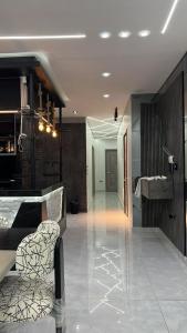 a lobby with a bar and a chair in a room at Three-bedroom apartment in Mohandessin in Cairo +4 photos