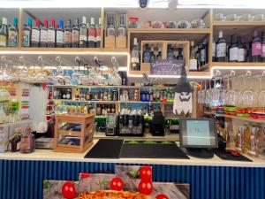 a bar in a restaurant with a pizza and drinks at Condo very close beach in Punta Cana