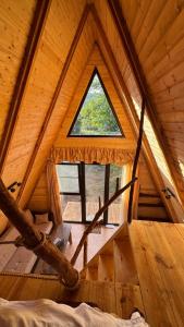 a room with a window in a wooden cabin at Old farm 1 in Ijevan