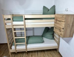a set of bunk beds in a room at apart-gerlos in Gerlos