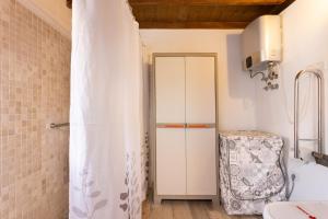 a bathroom with a shower and a white cabinet at Casa La Tosca in San Miguel de Abona +16 photos