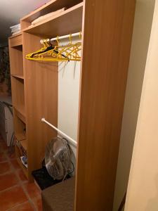 a room with a closet with a fan at Gite Deja Vu in Montcabrier