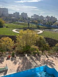 a view of a park with trees and a road at Hotel Nork Residence in Yerevan