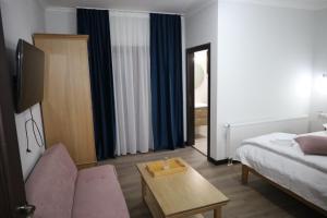 Ένα ή περισσότερα κρεβάτια σε δωμάτιο στο La SOFIIA