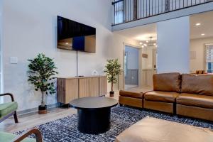 a living room with a couch and a table at 5BR Private Ranch Pet Friendly in Wake Forest